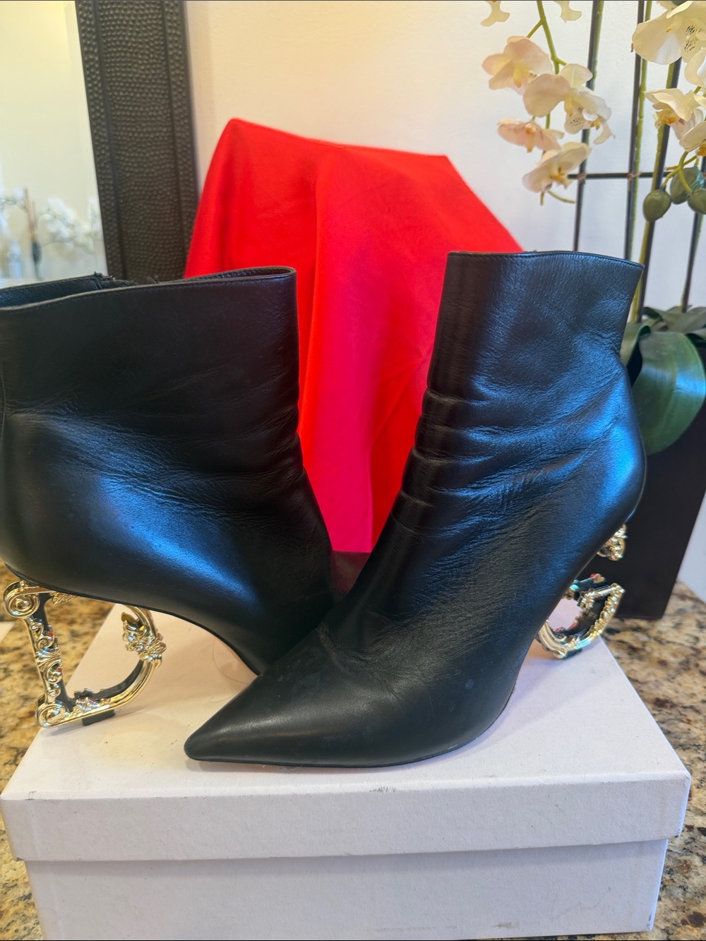 Dolce & Gabbana Black Leather Ankle Boots with Gold Sculptural Heels